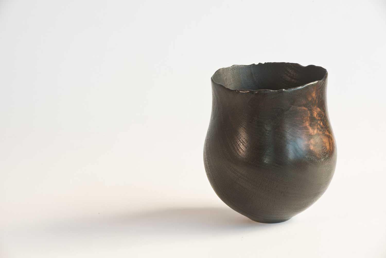 Wooden-Artefact-BB12-b Burnt wooden vessel with chard rim, repaired with hand-beaten copper